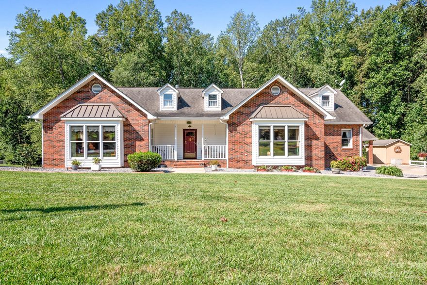 Welcome home to this stunning brick ranch in sought after Baymount Meadows on 1.25 acres. This home features 3 bedrooms, 2 full updated bathrooms, beautiful sunroom with tons of windows, office/exercise room. The kitchen has granite countertops, tile back splash, gas cooktop stove & SS appliances including the refrigerator to remain. New Heat pump 2023. Huge garage/workshop that is cooled & heated. Tons of parking!