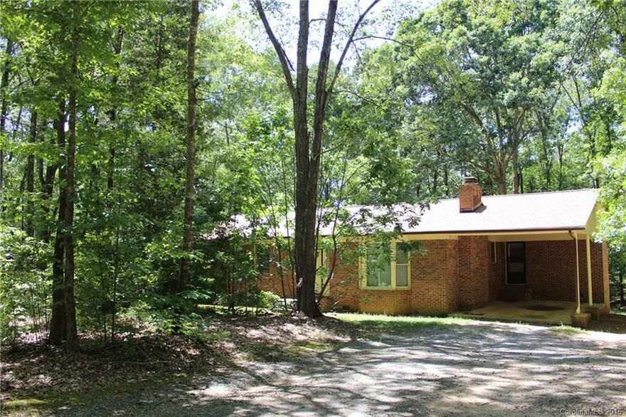 All Brick ranch on over 1acre, 5 minutes to Ebenezer Park and Lake access . Rock Hill Schools and York county Taxes. Large eat in kitchen with a bar . Lots of cabinets ,sliding glass doors going out on to back deck, over looking private back yard backs up to trees.Large pantry and mud/laundry room off kitchen. Step down into large great room with fireplace. Very private. Storage building
