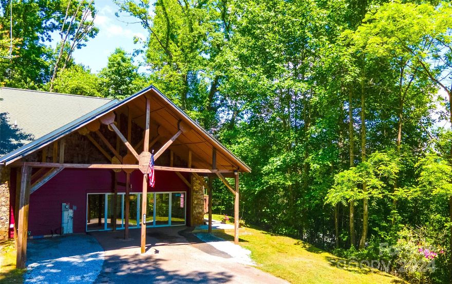 This enchanting mountain home really has it all including an extra lot! Imagine cozy nights curled up by the stone fireplace and calm evenings sitting on the wrap-around porch looking out onto the mountains. More than just a 2 bedroom/2.5 bathroom home, this cabin features a bonus loft with a half bath and 700 square feet of additional finished, unheated space - perfect for a game room, home office, or extra sleeping area.  Extensive updates throughout include all new paint, creating a bright and inviting atmosphere. Cathedral ceilings with tongue-and-groove accents and a wall of chalet-style windows brings the beauty of nature inside. Located at the end of the road on top of a knoll, this home boasts privacy while still being minutes to restaurants, shopping and downtown Franklin. Property includes a large carport, two lots and a clean shed. High speed internet available. This mountain oasis is truly a gem - don't miss your chance to own a piece of paradise!