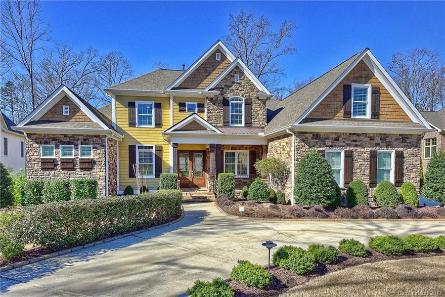 Curved driveway leads you to this custom built home. Double French front doors greets guests to an open floor plan on the main level to include formal dining room with beverage bar, office, as well as master suite. The gourmet kitchen is the entertaining hub. Upper level features 4 large BR's (3 each with private bath), media room. This home  features hand-scraped HDWD floors & granite countertops throughout, abundant storage, custom cabinetry, double wall ovens, 3 car garage, 2 gas log FPLs.