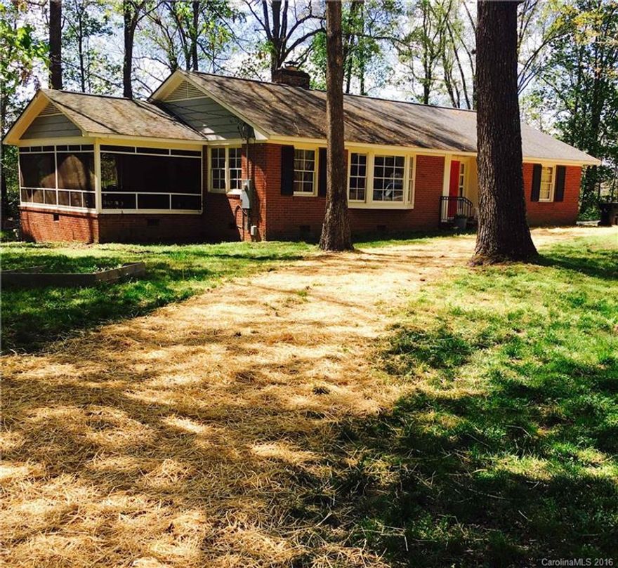 SO much character in this very large all brick home on over an acre, quiet & private yet close to downtown Monroe. Huge kitchen, beautiful HRDWS, ceramic tile in both baths, living/dining rm features gorgeous fireplace & convenient built in book cases. Lovely large screened in porch & bay window. Newser roof, Tons of storage. All appliances &washer/dryer convey. Seller owns lots next door also. See mls attachments. A must see! Will not last long! Seller is in the process of cleaning/moving out.