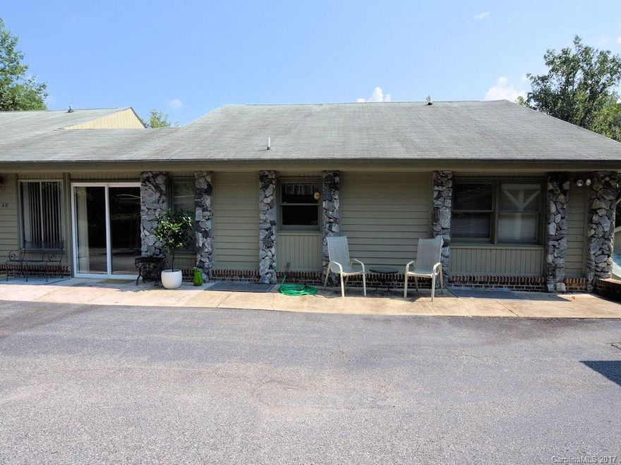 Take a look at this expansive, end unit condo just outside of downtown Tryon. The open floor plan allows for an easy set up of your layout plans. There is an amply sized kitchen w/ an adjacent formal dining room. The open living/dining room is accented by hardwood floors and a vaulted ceiling. A nicely sized master suite, a guest bedroom and den round out the rooms. There is also an enclosed front porch for sitting & your favorite plantings. The outdoor area features 2 carports & a storage shed.