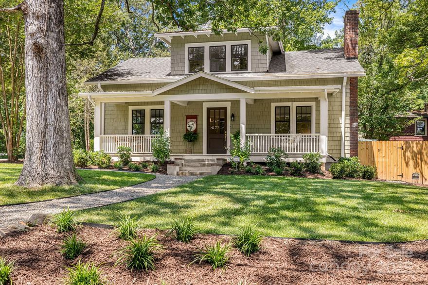 This classic Montford Arts & Crafts home pairs timeless 1920's character with a meticulous full-scale renovation. No expense was spared to create a brand-new feel while preserving its historic charm. Set on a private, beautifully landscaped corner lot, the 4BR/4BA main home features sunlit rooms, 9’ ceilings, refinished original hardwoods, gas fireplace, chef’s kitchen with massive island, new appliances, and a main-level primary suite. Upstairs, three additional bedrooms and two new baths offer space and privacy. The main house has not been lived in since the renovation - a truly fresh start. A rare bonus awaits beyond the main home: an updated 2BR/1BA carriage house with private entrance and modern kitchen - ideal for a long-term rental, guests or home office. Enjoy lush landscaping, fenced yard, expansive back patio, three parking spaces, updated systems, and proximity to parks, restaurants, and downtown Asheville. Move in and live the Asheville dream!