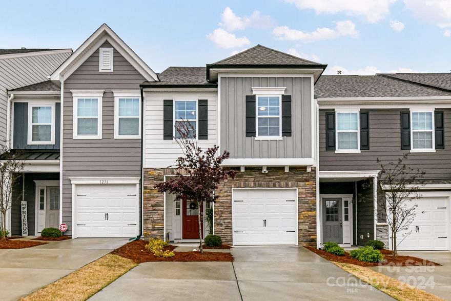 A Paddlers Cove Gem! This nearly new townhouse offers 3 bedrooms and 2.5 bathrooms including the Open concept floor plan. This well-maintained townhouse is located within miles of the Tega Cay and Fort Mill Shopping with easy access to the City of Charlotte. The covered front porch and the inviting foyer set a cozy tone upon entry to the home.  Large, open family room has a gas fireplace and plenty of windows for tons of natural light. Upstairs you will find 3 spacious bedrooms, the primary bedroom has a large walk-in closet, dual vanities, water closet and linen closet. Convenient laundry located upstairs. Paddler’s Cove is conveniently located near Lake Wylie in the Award-Winning Clover School District, walk to the Elem. School. Walk to Field Day Park and play pickleball! Enjoy low maintenance townhome living with amenities including Pools, Cabana, Playground, Kayak/Canoe Launch, Walking Trails, sidewalks and street lights. 30 min. commute time to downtown Charlotte! 1.5 to shopping!