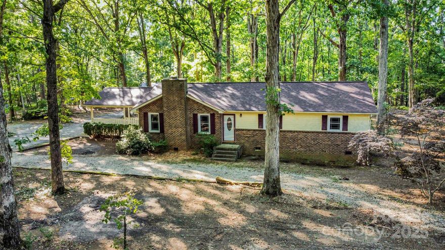 Tucked away on a private 2.71-acre wooded lot with no HOA, this updated 3-bedroom, 2-bath ranch offers privacy, space, and modern upgrades throughout. Inside, you’ll find fresh paint, new flooring, and a fully renovated kitchen featuring new cabinets, granite countertops, and stainless steel appliances. Both bathrooms have been stylishly updated, and new windows bring in natural light to every room. Major improvements include a new roof, HVAC system, and ductwork all completed in 2024, giving the home a refreshed and move-in ready feel. Outside, the property is complete with a 30x31 fabricated steel workshop that is fully heated and cooled, outfitted with upgraded commercial doors, and its own separate electric bill—an excellent setup for hobbies, projects, storage, or business use. Surrounded by trees on a quiet lot, this home combines modern updates with a peaceful setting that’s hard to find!