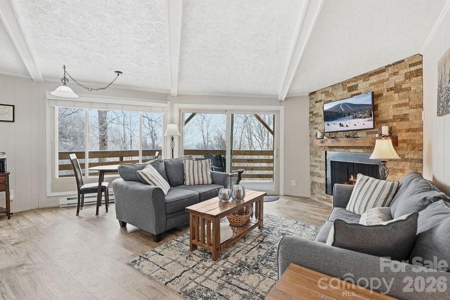 Enjoy the convenience of being in the heart of everything the High Country has to offer with this fully-furnished, cozy Sugar Mountain condo. Located within walking distance to the Sugar Mountain ski slopes and just around the corner from golf and tennis at the Village of Sugar Mountain, this property offers year-round enjoyment. Recent updates make this unit truly turn-key, including a new sofa, loveseat, bed, and mattress; luxury vinyl flooring; new tile and fixtures in the bathroom; new range, built-in microwave, dishwasher, washer, and dryer; new water heater; new pots, pans, and dishes; new gas logs with a timer; and a freshly striped and sealed deck. Exterior improvements include a new roof, fresh paint, tree removal, and a new parking lot. Whether you’re looking for a weekend getaway, second home, investment property, or full-time residence, this condo is ready for you to move in and start enjoying mountain life. Spend beautiful summers taking in the cool mountain air from one of the largest wrap-around decks at The Timbers, and cozy up by the fire after a day on the slopes in the winter. From spring through fall, open the sliding door to extend your living space onto the spacious covered deck. The large glass doors and floor-to-ceiling windows fill the home with natural light, creating a peaceful, treehouse-like setting year-round. Water & sewer are through Carolina Water Service.