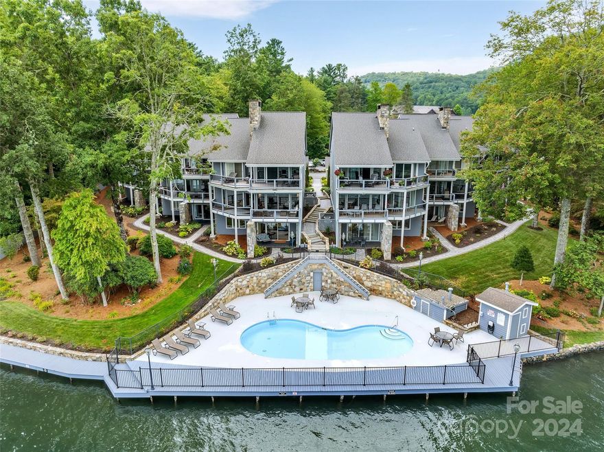 Absolutely stunning 3BR/3BA lakefront condo adjacent to The Greystone Inn, Lake Toxaway Country Club, Marina, and all amenities at Lake Toxaway.  This spectacular and spacious main floor unit features hardwood floors, fully renovated kitchen and baths, granite countertops, stainless appliances, two wood burning fireplaces, two bedrooms and bathrooms on the main floor, a guest suite and large family room downstairs, sauna, lots of storage, covered parking, and sweeping views of Lake Toxaway and the surrounding mountains.  This unit also includes a deeded boat slip at the Lake Toxaway Marina.