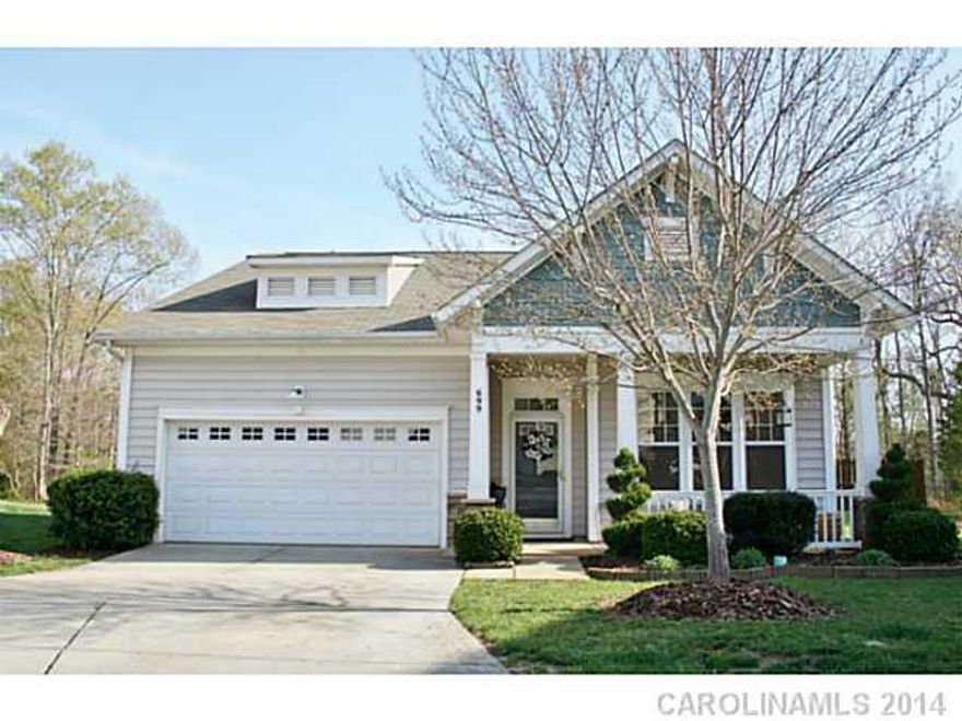 This cozy ranch shows like a model home! Elegant and inviting with neutral decor. Enter into a stunning long foyer with hardwood floors that span into an open great room with gas fireplace. Large gourmet kitchen w/ 42" cabinetry, granite counters, ceramic back splash and island w/ seating. Large MB w/ private bath, closet w/ built-in organizer. Custom built back patio with fire pit. Fenced yard.