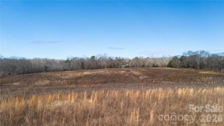 This 9.39-acre tract in Polk County offers gently sloping, open land with a long history of agricultural use. The property has been cleared and previously used for crops, making it well-suited for continued farming, livestock, or a private homesite.

The land is unrestricted, giving buyers flexibility for a wide range of uses. Its open layout and terrain also make it an excellent hunting property—numerous large deer have been harvested here over the years.

Located less than 100 yards from the South Carolina state line, the property provides a rural setting while remaining convenient to surrounding areas. Whether you’re looking to build, raise livestock, or invest in usable acreage, this tract offers versatility and strong potential.

If you’d like more details or want to walk the property, give our office a call!