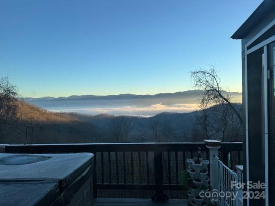 Looking for a home that has incredible long-range mountain views?  Looking for the perfect property to escape the realities of this world?  This property is the perfect cozy mountain cottage with amazing views and a great income-producing opportunity for the investor.  Included with this property is a whole house generator, privacy, hot tub, storage sheds that have been painted to match the house, an attached carport for one car, large windows, gas fireplace, hardboard siding, and only a mile off a paved main road.  Termite Bond can be transferred to the new owner. 
 This property is a gem that's not easy to find.  Could be your permanent home, weekend retreat, or investment property.