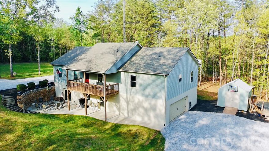Welcome to 645 Camp Creek Road in Union Mills, North Carolina—set on 7.09 private acres where peaceful surroundings and flexible living come together. This 3,428 sqft home features dual primary suites, one on the main level and another in the beautifully finished basement, offering the ideal setup for multi-generational living or hosting guests with ease. Enjoy quiet mornings on the front deck and unwind in the evenings on the patio, all while taking in the natural beauty of open space and wooded privacy. Thoughtfully designed, this property offers a seamless blend of comfort, versatility, and serene country living.