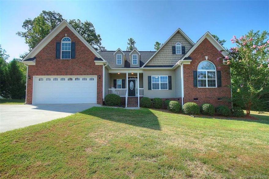 3BR/2BA custom built ranch with finished bonus over garage with 1.20 beautiful acres of land. Surrounded by mature trees and privacy, conveniently located within minutes of I-77 in the Richard's Landing neighborhood. Interior features include Brazilian cherry hardwoods, granite, maple cabinets, tile, cathedral ceilings in living, master and dining, fireplace, picture frame moldings and more. Double sink vanity in Master BA. Screened porch and deck. Move in ready with clean neutral finishes.