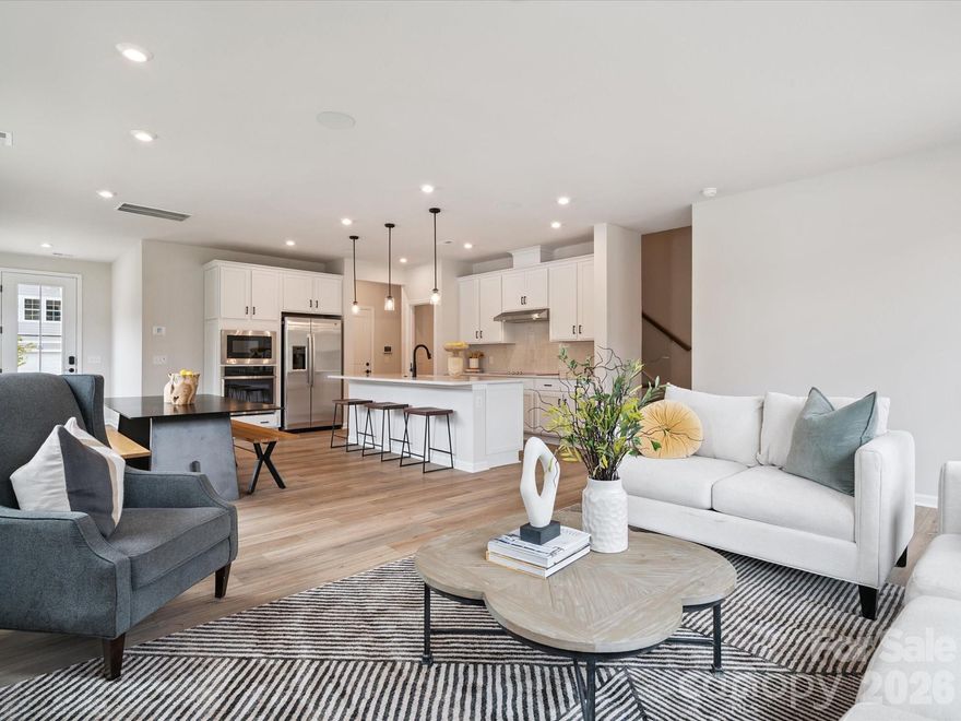 This end-unit Millstone home is filled with natural light, thanks to added windows and a thoughtfully designed two-story layout. Offering three bedrooms, two-and-a-half baths, and a two-bay front-load garage with a full-length driveway, the home balances comfort with everyday convenience. Warm brown cabinetry paired with quartz countertops anchors the kitchen, while oak box stairs and a convenient drop zone near the garage entry add character and function throughout the home. Outdoor living space invites you to unwind, with community walking trails just steps away. Located in Cramerton, NC, Millstone offers easy highway access and a quick drive to Uptown Charlotte, making it simple to stay connected while enjoying a more relaxed setting.