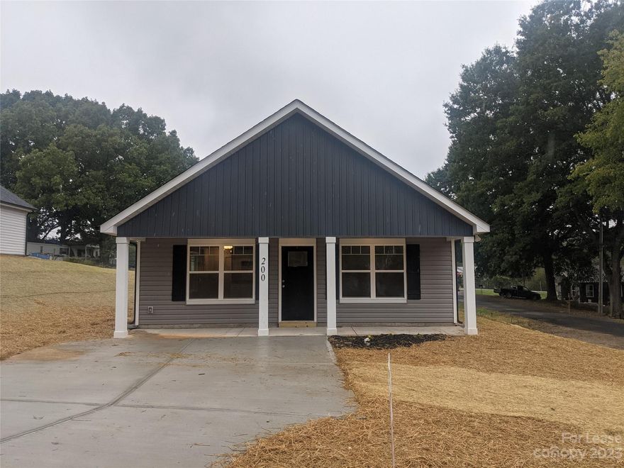 Beautiful newer home close to downtown Kannapolis. This cute 3 bedroom 2 bath house features a covered front porch, LVP floor throughout, window blinds, large living room with ceiling fan, eat-in kitchen with granite counter tops, SS appliances, refrigerator included & walk-in pantry. This split bedroom plan has a lovely primary bedroom w/lg. walk-in closet, ceiling fan, on-suite bathroom w/granite counters and lg. shower. Laundry room w/drop zone that connects to the backyard. Two good sized secondary bedrooms w/nice closet space. The hall bathroom features granite counter tops and nice bathtub. Located close to downtown Kannapolis, shopping, food, entertainment and easy access to I-85, this is one house you don't want to miss. Tenant responsible for lawn/landscape maintenance & all utilities. No pets are allowed.