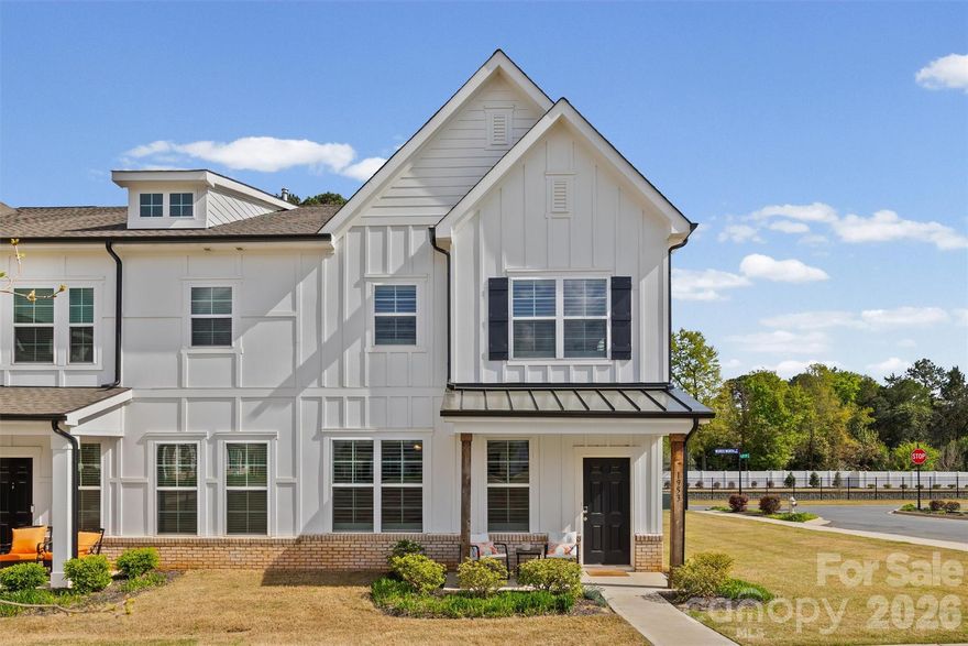 Welcome to this beautifully maintained end-unit townhome tucked away in one of the most desirable pockets of the Auden community—where privacy, natural light, and thoughtful design come together effortlessly. Positioned at the edge of the neighborhood, this home offers a rare sense of quiet and seclusion, with additional windows that flood the space with natural light and create an airy, open feel throughout. Enjoy peaceful surroundings while still being just moments from the best of Rock Hill’s growing shopping, dining, and everyday conveniences. Inside, the open-concept layout is both functional and inviting perfect for everyday living and entertaining. The spacious kitchen features granite countertops, stainless steel appliances, and a seamless flow into the main living area. Elegant plantation shutters throughout add warmth, charm, and a timeless designer touch.
The primary suite is a true retreat, complete with a tray ceiling, spa-like walk-in shower, and dual walk-in closets. Generously sized secondary bedrooms offer flexibility for guests, a home office, or hobbies making this home as versatile as it is beautiful. A two-car attached garage adds convenience, while the end-unit positioning provides the feel of a single-family home with the ease of townhome living. Homes like this private, light-filled, and move-in ready in such a prime location don’t come available often.