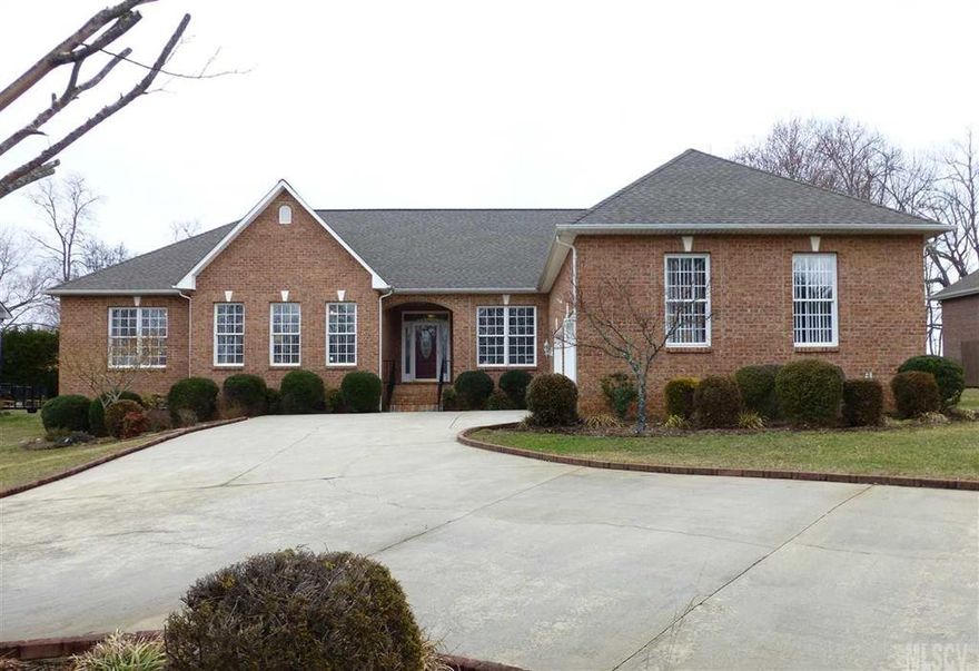 Enjoy main level living in this beautiful ranch style brick home w/lovely in-ground pool, fish pond & awesome outdoor entertaining areas. Over 2600 htd sqft on a .40 acre lot. Stately foyer w/columns, gleaming hardwd floors, formal LR offers vaulted ceiling leading to formal DR (tray ceiling) + a cozy den w/a gas log FP. Separate study w/French doors.  Gorgeous KIT--center island & nice custom cabs, granite counter tops, tile backsplash, stainless appliances, built-in pantry cabs (larger one w/pull-outs), & sunny breakfast nook. Spacious laundry rm. A large master suite includes a dbl door entry, tray ceiling, private deck, WIC & a luxurious bath (jetted tub w/tile surround, walk-in tiled shower, dual sink vanity w/granite top & tile floors). Hall bath offers dual sink vanity w/granite top, jetted tub/shower, & tile. 2 other large BR's w/WICs. Circular drive. NEW Electric Hot Water Heater in Sept.'14. NEW HEAT PUMP--May 2015! Propane Tank is leased--Blue Ridge Electric (gas logs only).