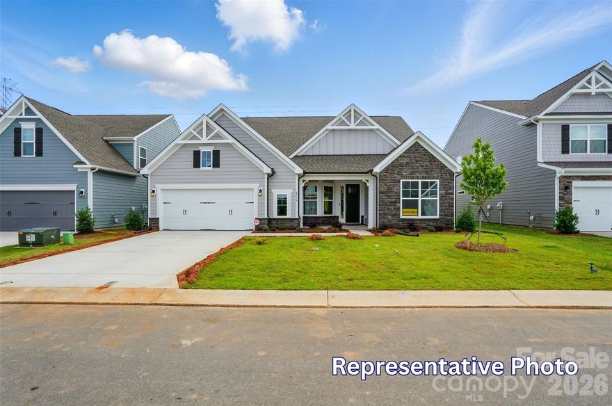 Brand new construction in an amenity-rich community less than two miles from Lake Norman! This Edgefield ranch-style plan offers 3 bedrooms, 2.5 baths, and more than 2,600 square feet of living space all on one level. The central living area of the home has the kitchen, breakfast area and family room with a gas fireplace. The designer kitchen has white cabinets with a contrasting grey island, quartz counters, a tile backsplash, and stainless appliances. A butler pantry with upper and lower cabinets and quartz counters leads to the dining room with tray ceiling. The office has built-in, grey cabinets with white quartz counters. The primary suite has a tray ceiling and a luxury bath. Two secondary bedrooms, a full bath, powder room, laundry room, and mud room with drop zone complete the main floor. This home also includes a covered rear porch for your outdoor enjoyment. Community amenities include a pool, cabana, pickleball courts, and pocket parks!