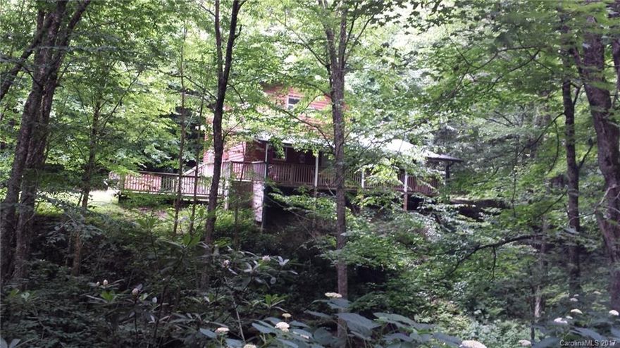 Are you interested in solitude but not being too remote? Does the sounds of a rushing creek and water falls running through your own land sound good to you? How about a modern but cozy spacious home a stones throw from the Blue Ridge Parkway and what about a National Park as your neighbor? This 2 bedroom home has comfortable sleeping space for 10. Nestled in trees, your creek along the whole length of your domain and virtually no maintenance for you to do. What are you waiting for? Come on up!