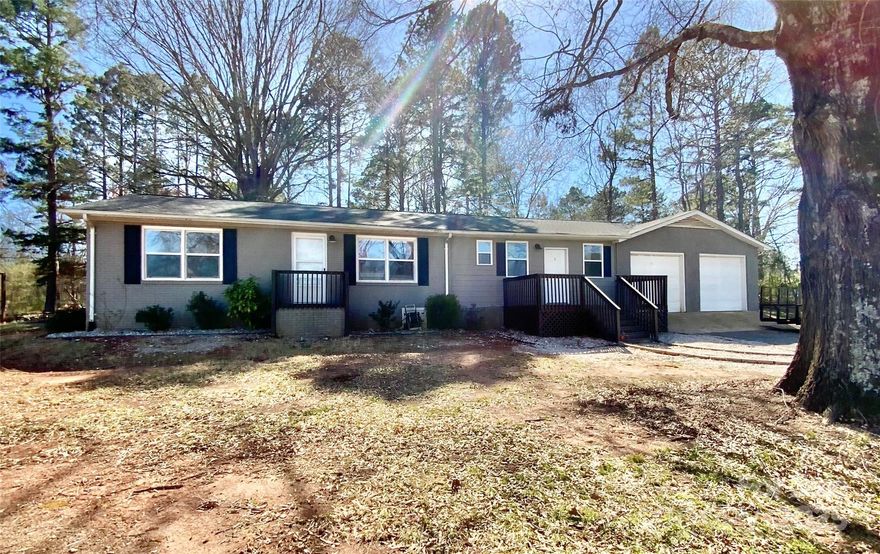 This delightful ranch-style home is situated on a spacious .93 acre corner lot and there's *NO HOA*. Featuring 3 bedrooms and 2 full bathrooms, it’s an ideal space for anyone looking for extra room. The oversized 683sf garage provides ample space, not just for your vehicles but for additional storage or workspace. Step outside to the fully fenced-in backyard, complete with a fire pit and a covered back porch. There’s also a second fenced-in side yard next to the garage, great for pets or outdoor activities. Recent updates including new flooring and fresh paint throughout, this home is ready for you to move in and enjoy. Did I mention there's NO HOA?! Come see it for yourself!