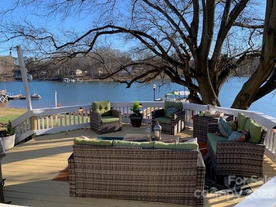 Exceptional Waterfront Retreat w/year-around deep water.  An entertainers dream.  Huge cove location just off the main channel provides the Big Water view you want without the wear and tear on your dock.  Gentle sloping backyard with multiple outdoor living spaces is perfect for hosting family and friends.  Take in the breathtaking views from either the upper screen porch or the lower hardscape patio.  When your crowd moves inside, there’s plenty of space around the huge Island in the Chef Inspired Kitchen.  Double wall ovens and Thermador gas cooktop w/warming drawer make the hosts life easy.  When the game starts, just step into the media room w/ Theatre seating.  At halftime, step over to the Bar and large waterfront family area.  So many spaces and so much to enjoy. Lake fed irrigation. Perfect location near Shopping, Dining, Recreation, and Healthcare.  Easy commute to Airport and Charlotte.  No HOA.  What do they say about Opportunity knocking?  This is it!
