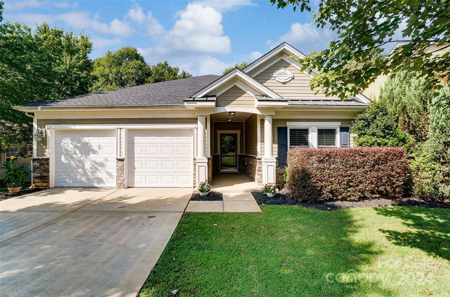 Welcome to this charming 1,962 sq ft ranch home in Fort Mill, featuring a perfect blend of modern updates and classic style. Enjoy the bright, airy ambiance with lots of windows, new paint, and fresh carpet throughout. Elegant wood plantation shutters add a touch of sophistication, while a unique grasscloth wall treatment in the great room enhances the home's character. The gourmet kitchen boasts a gas range, stainless appliances and work island, ideal for culinary enthusiasts. Primary Suite offers double walk in closets and garden tub. Secondary bedrooms share a full bath. Step outside to a gorgeous custom patio and a beautifully landscaped homesite, perfect for outdoor entertaining or relaxing. This meticulously maintained home offers comfort and style in the desirable Madison Green community! Fantastic location, just minutes to I-77, downtown Fort Mill, Kingsley, Baxter Village and all that Uptown Charlotte has to offer as well as Regent Park Amenities! Welcome Home!