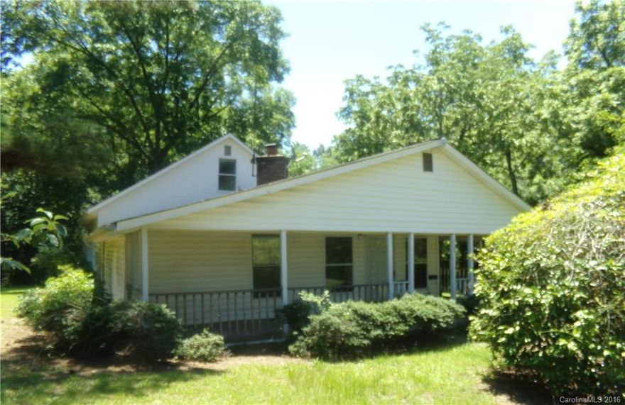 Make this spacious house that features 3 bedrooms and 3 bathrooms a home, with your own update/renovation ideas.  The large eat in kitchen has room for a center island or large table.  The cozy living room features a fireplace.  The basement/garage area has area for your hobbies or storage needs. Enjoy the large front covered porch or roam around on the 1.9+- acre lot!