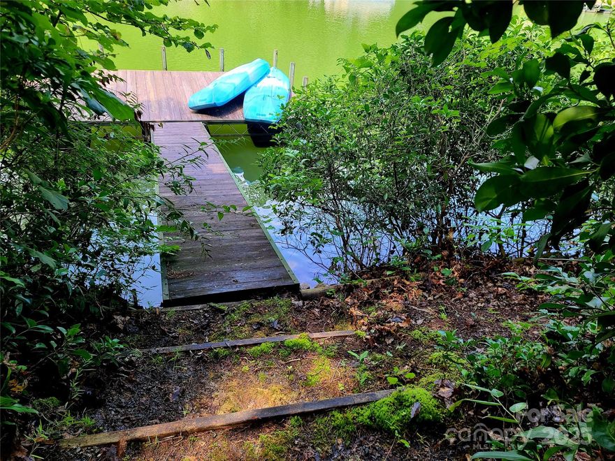 Discover the magic of Lake Adger living!
Nestled in the heart of Mill Spring, this beautiful 1-acre waterfront lot offers the perfect blend of privacy, serenity, and outdoor adventure. Located in one of the area's most desirable communities, you'll enjoy 145' of shoreline on a peaceful north-facing cove—complete with a floating dock already in place.

Whether you’re into hiking, horseback riding, or just soaking in the natural beauty, Lake Adger has it all. The community features equestrian and hiking trails, and you're just minutes from the Tryon International Equestrian Center and FETA trails.

The lot features a gentle slope, with a gravel driveway and path already laid for access to the lake.

If you’ve been dreaming of a lakefront homesite with tranquil views and outdoor recreation, this is one of the last premium waterfront parcels available—don’t miss your chance to build your getaway here!