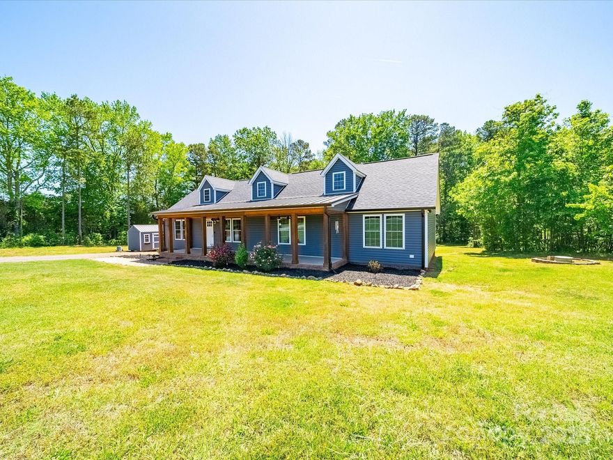 Country privacy but also convenient to Concord, Mt. Pleasant, and Rowan County. Improvements galore including new roof, windows, siding, HVAC, flooring, deck and a stunning front porch addition all in the last 4 years (a complete list is provided in the attachments). Complete kitchen remodel with soft touch cabinets, handmade butcher block island, quartz countertops and high end appliances. Oven doubles as an air fryer. A 4th room can be used as office or additional bedroom. Thermostat has WiFi capability. Unfinished bonus area upstairs has capped off plumbing, insulation, and recessed lighting installed. A graded 40x40 pad for a future garage. Driveway from the main road is 45' deeded right of way back to a 1.2 acre parcel. A Blink video doorbell is installed with cameras on each corner of the house. Dog lots do not stay but building can be negotiated. The Knorr Group of Alcova Mortgage is offering a $4500 lender credit.