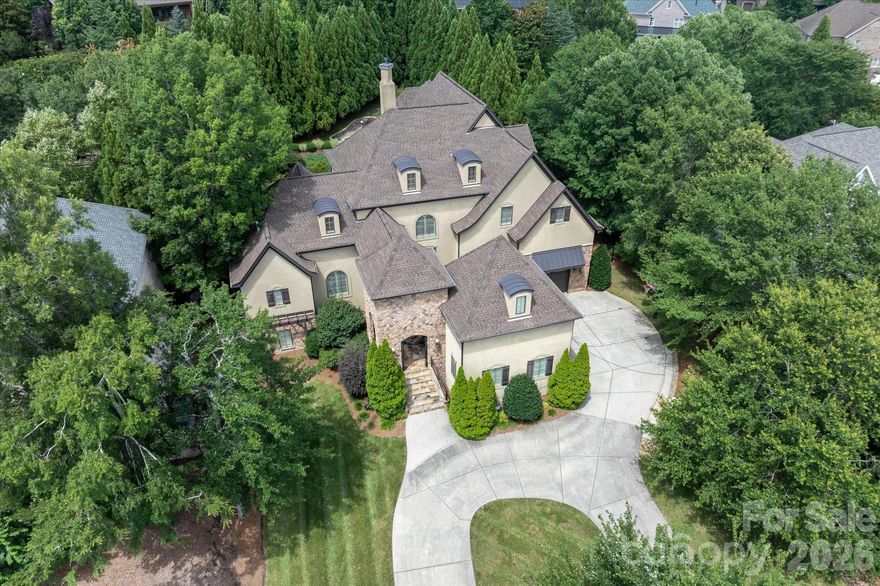 Over 9,000 square feet in gated Providence Downs South! The main level features primary and guest bedroom suites. The outdoor living in this home is endless - fantastic easy breeze porch, outdoor fireplace, multi-level outdoor spaces and saltwater pool! Walkout basement is truly unbelievable!