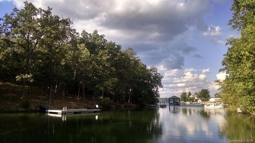 Liberty Hill Pointe Sub: Large 1.5 acre waterfront lot features 200+ feet of shore line.  Quiet, deep cove with main channel views.  Bring your own builder!   Dock already in place, bring your boat, watercraft and an appetite for serene, lakefront living. DHEC septic permit approved for 4bed. Contact Joe Jordan to schedule a private tour of the property. Owner financing available.