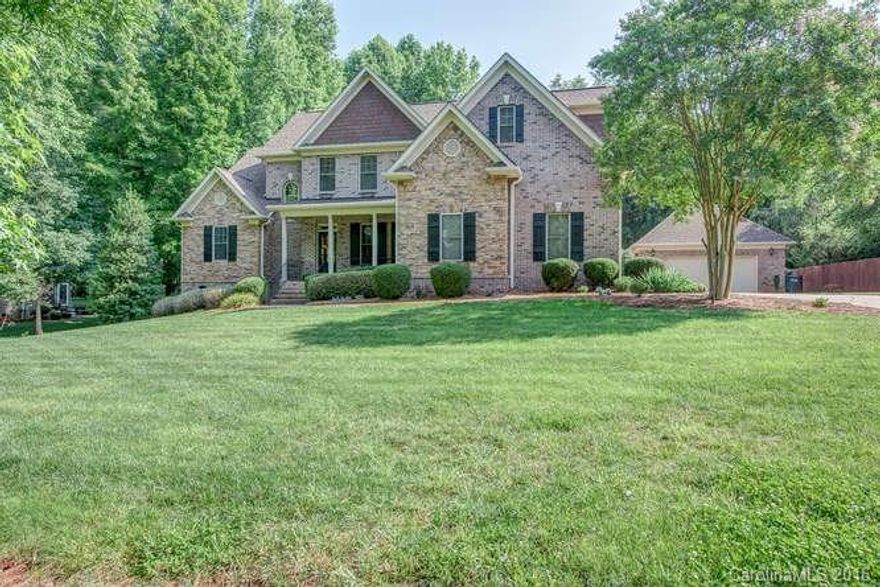 Outstanding custom brick home features gorgeous attention to detail. Lovely arches & detailed moulding in dining room, kitchen & great room. Kitchen has stainless appliances & granite w/casual dining area, breakfast bar. Soaring ceiling & roaring fireplace in Great room. Master on main w/whirlpool tub & separate shower. 2nd BR on main, Computer Niche & huge Bonus upstairs. Screened porch & salt-water gunite pool. 2-car attached+2 car detached garage. Award-winning Clover schools, low SC taxes.