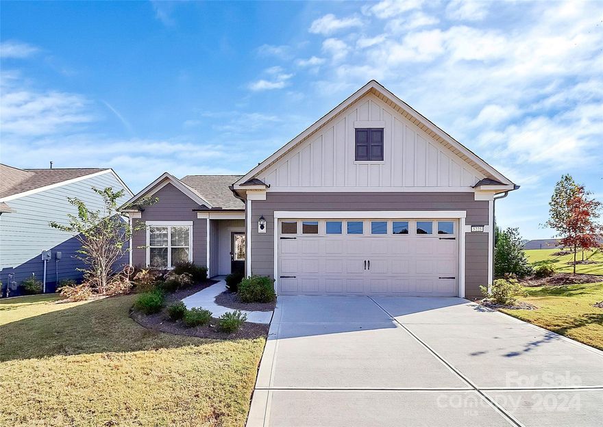 Charming 2 bed/2 bath ranch + office in the desirable and amenity rich 55+ Carolina Orchards community! Owners have access to tennis, pickleball and bocce courts, a clubhouse with fitness center, pool and spa, walking trails and so much more! Built in 2022, this home offers you an open floor plan, stunning laminate wood flooring flowing throughout, a massive chef's kitchen and a split bedroom floor plan for privacy. The kitchen truly is the heart of the home with an extended island, SS appliances, subway tile backsplash, spacious pantry, and endless countertop and cabinet storage. This space is open to your dining area and living room, offering you the ideal spot to entertain family and friends. With easy access to your covered back porch, you can enjoy your morning coffee or evening cocktail out back. The primary retreat boasts tray ceilings, en-suite with a large stand-alone shower and a massive walk-in closet. Your secondary bedroom is sizable with access to a full bathroom.