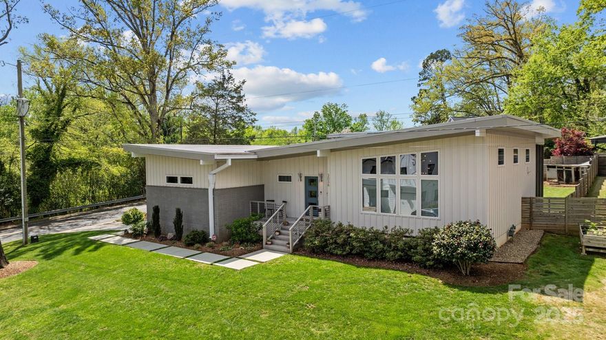 Spectacular Country Club Heights corner lot home with period-correct, mid-century modern design & soaring "butterfly" roof & ceilings.  3 bedrooms, 2 full baths & 2 car garage.  $20k kitchen update in '23 with new cabinet facing & hardware, tambour clad island, backsplash, & exhaust.  $10k Primary & secondary closet systems as well as walk-in pantry system in '24.  Primary bathroom with curbless shower and dual shower heads.  Custom treatments throughout home including updated fixtures throughout.  Site finished oak hardwoods thru-out.  $12k screened-in porch in '24.  Extensive landscaping with fenced back yard.  One of only four homes in Country Club Height's Atomic Palm Development built in 2017 which was awarded the Historic Preservation Award for new infill development by the Charlotte Museum of History. A great value in hot CCH. Charlotte Observer link highlighting the Atomic Palm Project at https://www.charlotteobserver.com/charlottefive/c5-around-town/article236108443.html