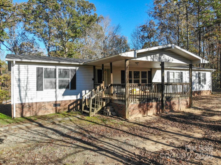 Opportunity awaits with this spacious 4-bedroom, 2-bath doublewide in Morganton, NC, near the scenic Blue Ridge Mountains! Enjoy easy access to I-40 and a short drive to golfing, entertainment, and endless outdoor activities. With two generous common areas, a cozy fireplace, and a bright dining area with sliding glass doors leading to the backyard, this home has a comfortable layout perfect for entertaining. The kitchen boasts ample counter space and storage. Previously used as a rental, it’s an ideal investment to add to your portfolio or to renovate and put back on the market. Don’t miss out!
