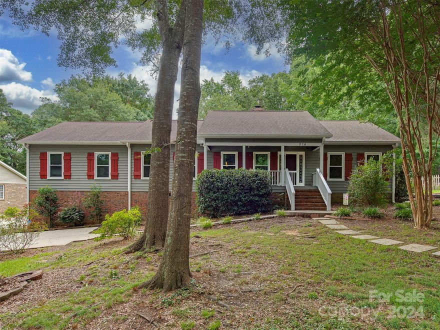Welcome to 214 Heathergate Lane in Stanley, NC, just a short 15-mile drive to Uptown Charlotte. This charming 3-bedroom, 2-bathroom home offers a serene retreat with 2,222 sqft of living space on a .72-acre lot. As you step inside, you'll be greeted with vaulted ceilings and exposed wooden beams, creating a cabin-like charm. 
The renovated kitchen and main bath add modern elegance, while the private yard is perfect for relaxation and outdoor activities. The extended garage provides space for 2 cars, a workshop, and a flex area for projects and hobbies. The finished and heated basement area of 613 sqft offers a versatile space for various activities.
Additional amenities include a whole home water filtration system & water softener, a large storage shed, and an assumable 3% interest loan for any VA buyers. Don't miss out on this unique property that offers modern comfort and cabin-like charm. Schedule a tour today and envision the possibilities that await in this delightful home.