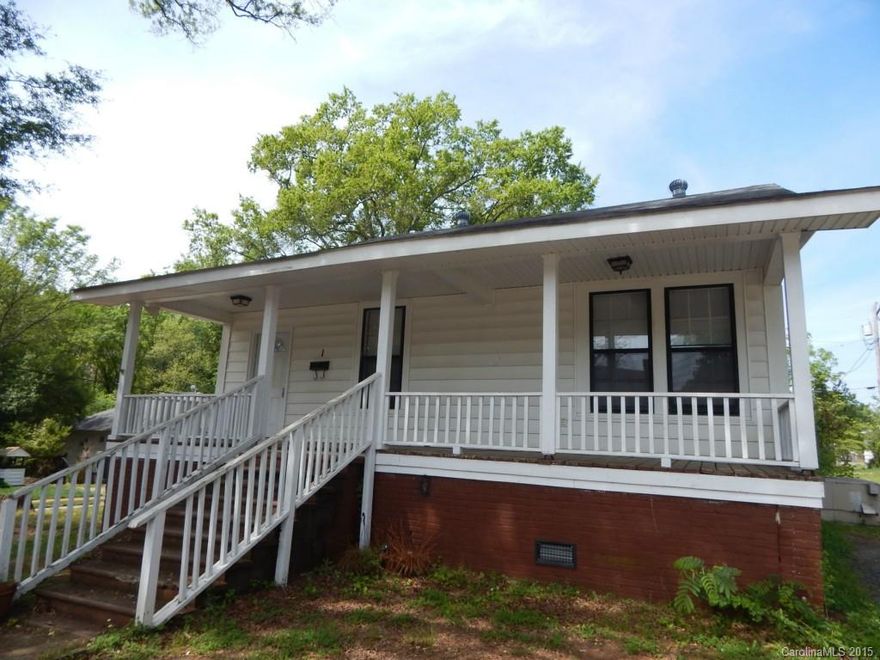 Move in ready home in convenient location on corner lot with rocking chair front porch