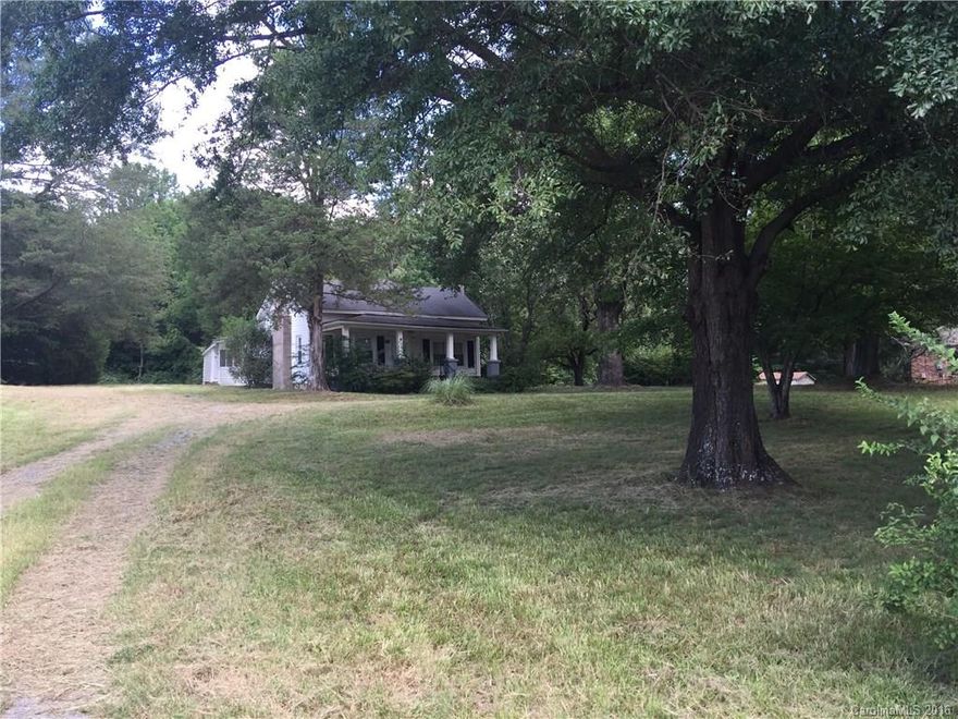 Great little home on 1 acre.... to be subdivided from larger parcel #212514.  This home is in very good condition.  The KT is large and the full bath is also large.  Of course there is character in this house.  The fire places are as is.  Tax records call this a 2 bedroom home althought there is only a closet in one room.  The patio and covered porch on the back of the home provide other areas to us.  HVAC is only 4 yrs old. Grat little house in a great area.