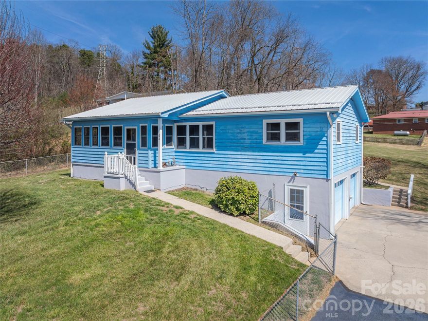 Welcome home to this beautifully maintained Ranch nestled on 0.41 acres in the heart of Canton. With a spacious, lush green fenced-in-yard and mountain views as your backdrop, this property offers the perfect blend of comfort, character, function, and everyday charm. Inside, you'll find an open and airy floor plan designed for connection - featuring a galley kitchen with custom cabinetry, generous counter space, gas range, and a seamless flow into the dining area. Whether you're hosting or enjoying a quiet night in, this space feels both practical and inviting.

The main level offers three bedrooms, while partially finished walk-out basement expands your living options with an additional bedroom and full bath - ideal for guests, a home office, or multi-generational living. 

Start your mornings on the enclosed front porch and unwind in the evenings on the covered rear deck, surrounded by peaceful outdoor space that's ready for gatherings, pets, or simply soaking in the fresh mountain air. 

Conveniently located just minutes from dining, shopping, and everyday essentials, this home offers the ease of in-town living with the comfort of a tucked-away setting.