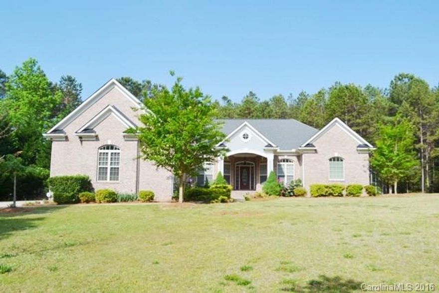 Stunning custom built home located in Waxhaw has tons of architectural details.  Beautiful home for entertaining w/ easy flow on main level. Home features LR, office with French doors, formal DR, 2-story great room with fireplace.  Gourmet granite kitchen has stainless appls, tile back splash, double oven.  Master on main w/ luxurious bath! 2 BR downstairs with bonus/bed on 2nd level.  Large unfinished deck w/wooded view, and nicely groomed yard. *View of horses free, farm not included.