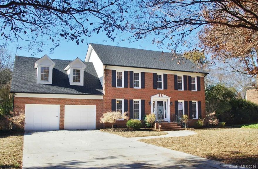 Classic full brick 2 story traditional in sought-after Quail Acres! Unbeatable location coupled w/one of Charlotte's most desirable school districts makes this home a must see! Great floor plan w/elegant formal living & dining rooms, a spacious den with masonry fireplace flanked by built-ins on either side. The updated kitchen offers faux painted distressed cabinetry, granite countertops with beautiful backsplash & not but 1 but 2 pantries! New hardwoods, replacement windows & awesome back yard!