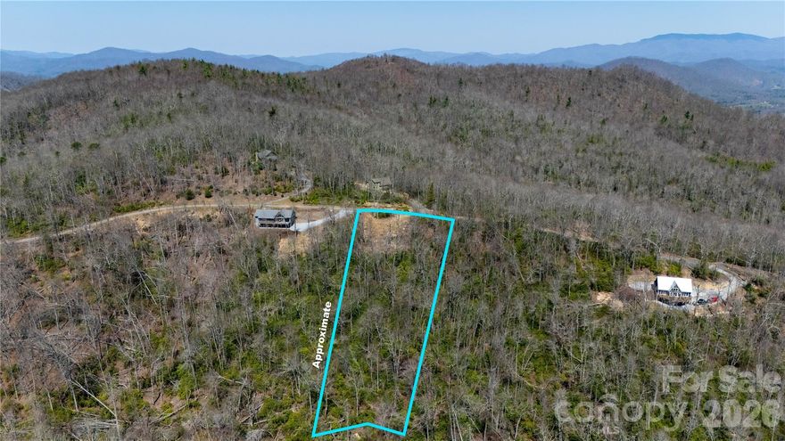 Alpine Mountain, a peaceful subdivision near Little Switzerland, NC, this beautiful lot sits at over 3,600 feet elevation and offers stunning 180-degree mountain views across the valley and distant peaks.
The lot is  build-ready. A circle driveway is already in place. You can bring your RV and stay on the property while you build, or simply enjoy it as a private mountain getaway. (camping limited to no longer than 4weeks)
Alpine Mountain is a quiet, attractive community of custom-built homes with low HOA dues that mainly cover road maintenance. The community roads are well-maintained gravel (with some paved sections)
At this elevation, you’ll enjoy crisp, cool summers and the peaceful beauty of winter snow. The area is surrounded by natural beauty and outdoor recreation, including the Blue Ridge Parkway, Mt. Mitchell, Emerald Mine, Penland School of Crafts, trout fishing, rafting, golf, and skiing. You’re just 5 minutes from Little Switzerland, 10 minutes from Spruce Pine and Blue Ridge Regional Hospital, and about 20 minutes from Burnsville.
Whether you’re looking for a permanent residence or a weekend hideaway, this lot gives you easy access, breathtaking views, and a serene mountain lifestyle in a friendly, low-key community.