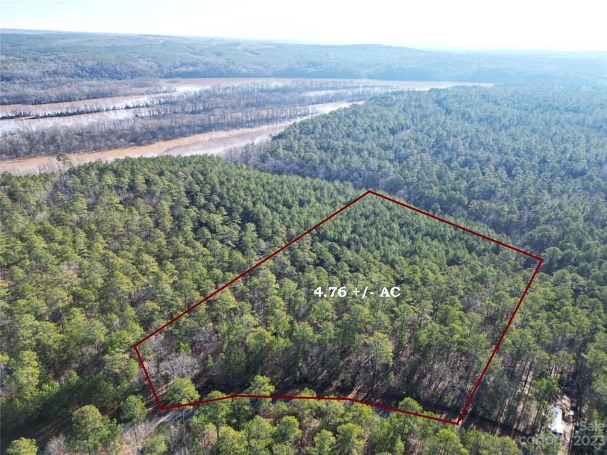 GATED COMMUNITY ON THE LAKE!!! LARGE 4.76 ACRE LOT. Beautiful Private Home Site Surrounded by Mature Hardwoods.  Just a short walk off the back property line to a common area on the lake.  300+ Acre WILDLIFE MANAGEMENT AREA where Bow Hunting, Hiking and Horseback Riding are permitted. Perfect Blank Slate for your Dream House. Two Amazing Timber Framed Community gathering Pavilions one with Stone Fireplace, one screened with picnic tables and Bathhouse with shower. Fishing, Skiing, Kayaking, Canoeing & Swimming in a serene natural setting.