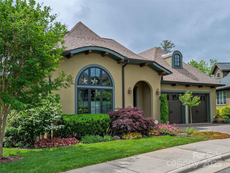 Discover the epitome of main-level living in this beautiful home, featuring a striking wall of windows that leads to a serene screened porch. Inside, enjoy the warmth of maple hardwood floors and a spacious kitchen with a large island, granite countertops, and stainless steel appliances, including a gas range. The primary bedroom offers stunning natural views and privacy, complemented by a luxurious ensuite bath with a marble walk-in shower, double vanity, heated floors, and a generous walk-in closet. Additional features include a guest bedroom and a versatile office/flex room with access to the upper level, which adds 1,400 square feet of finished space ideal for multi-generational living, an artist studio, or caregiver arrangements. This upper level includes another kitchen, full bath, bedroom, walk-in closet, and a living room with abundant natural light and breathtaking views. Don’t miss this exceptional opportunity to own a home that combines comfort and style!
