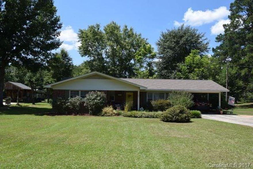 All brick ranch with front porch, patio, single carport and storage room.  New roof in 2011 and has a 30 year warranty, new AC - 14 seer in 2015.  3 bedrooms, 2 baths, great room, kitchen and eating area.  Would make a great started home or investment property.
