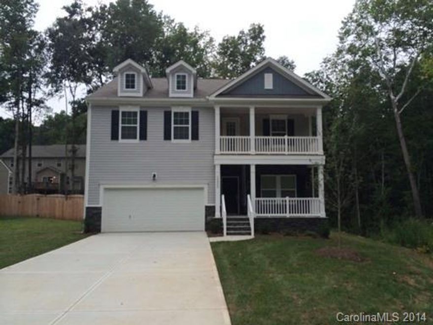 This lovely home has hard wood floors, a bonus room, a Formal Dining Room and a fireplace in the Great Room. The warm and inviting kitchen comes with all stainless steel appliances, a breakfast bar, a walk in pantry plus granite counter tops. The laundry room is located on the second floor. The Master Suite has two walk in closets and the Master Bath has dual sinks, an over sized tub and a separate shower. A deck leads you out into a well manicured back yard.