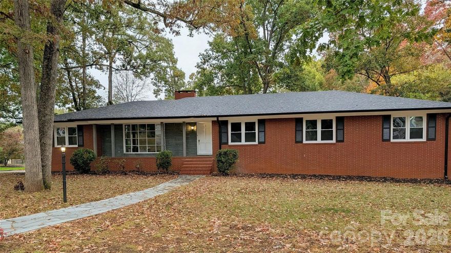 Beautifully renovated brick home in the desirable Forest Hills community of Albemarle! This spacious 5-bedroom, 2 full bath, and 2 half bath home offers modern updates with timeless mid-century charm. Enjoy brand new LVP flooring, a completely updated kitchen with new cabinets, countertops, and appliances, plus a new roof, new windows, and newer HVAC for peace of mind. The home features three fireplaces—two upstairs and one in the cozy, heated basement den with walkout access to the driveway and backyard. Perfect for family living, this home provides ample space, comfort, and character in one of Albemarle’s most sought-after neighborhoods. For those looking for a large garage or a space to have a shop at home the basement garage is HUGE!!