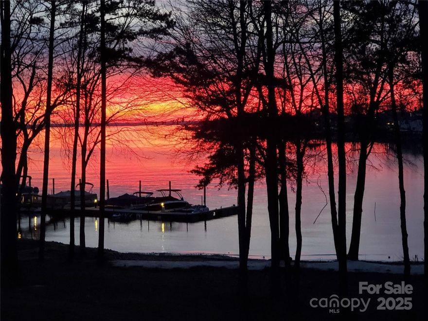 RARE FIND with expansive SUNSET VIEWS on LAKE NORMAN in the prestigious Cove Key neighborhood. A completely updated two-story luxury condo offering the comfort and privacy of a standalone home with the convenience of turn key living. With a sleek Miami-inspired design, find four spacious en-suite bedrooms, a stunning all-new kitchen with Hans Krug cabinetry, luxury lighting, 8’ solid-core doors, and soaring 10’ ceilings on both floors. Entertain with the oversized Sub-Zero wine fridge and bar area, and enjoy the convenience of motorized blinds throughout the home and on the patio. The primary suite is a true retreat, featuring a large walk-in closet and a beautifully updated spa-like bathroom. The modern steel-railed staircase leads to a loft with coffee bar and movie room. A two-car garage with an epoxy floor, finishes this home. This property includes a private boat slip and lift, and a new dock making lake living effortless. Close to Langtree at the Lake and the I77 corridor.