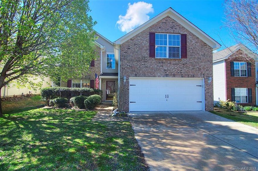 Fabulously updated home on the Tega Cay peninsula. Renovated kitchen with new stainless steel appliances, updated cabinets, ceramic tile backsplash, and new designer light fixtures. New flooring throughout - gorgeous dark laminate wood on main, new carpeting upstairs, new tile floors in bathrooms. Updated plumbing fixtures. Newer AC units - warranty remaining, tankless hot water heater, irrigation system, security system. Nicely landscaped flat yard, cul-de-sac street. Fort Mill Schools.