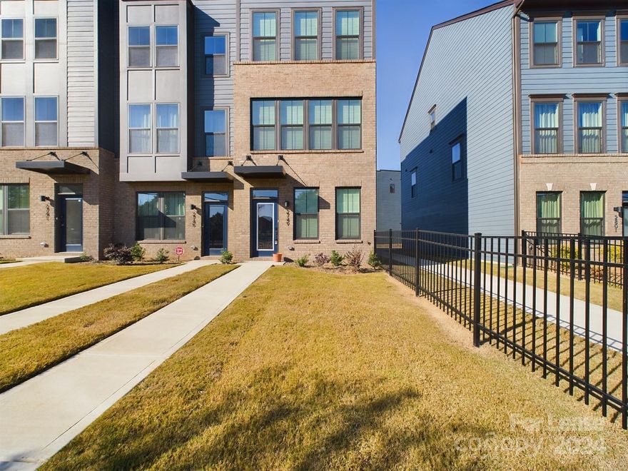 End Unit! This beautiful town home built in 2023 is a 3-story with 3 bedrooms, 3.5 bathrooms near Camp North End and uptown Charlotte. The lowest level has a 1-car garage, guest bedroom and a full bath. The main level is an open concept with a kitchen, stainless steel appliances, living and dining room, powder room and has a w/o to balcony. 3rd floor features primary bedroom with an ensuite bath with additional bedroom and full bath and laundry. This home comes with many upgrades including hard surface stairs throughout, quartz countertops in kitchen and bathrooms, backsplash, kitchen island.Just one minute off the interstates (77 and 85) and walkable to Heist Brewery and Camp North End. Enjoy the beauty of the uptown skyline from your balcony and tons of light from all the extra windows in this end unit townhome.