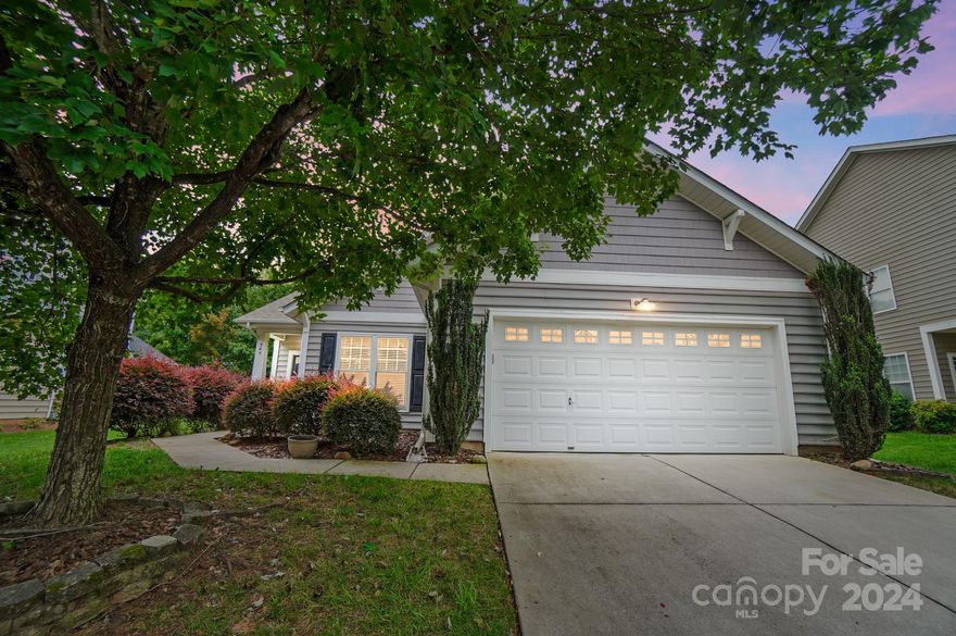 Adorable three bedroom two bath one story home with an large two car garage with storage and extra driveway parking minutes from 77 with so much charm.  The floor plan is open and great for entertaining your family and friends.  The kitchen has a window overlooking the patio and private backyard as well as an area for bar stools, lots of cabinets and counter space. The spacious primary suite has large windows overlooking the back yard as well, vaulted ceiling, ceiling fan, large en suite walk in closet, and en suite bath with separate garden tub and shower with tile surround and two sinks.  The roof was just updated 7/2024.  The HVAC was updated 2021.  The windows were updated 2021.  Our other favorite features are the archways, molding, fireplace, garage and front door with keypad entry, private backyard with trees and landscaping with patio, and front porch.  Refrigerator, washer and dryer are included. The seller has maintained a quarterly pest control.  Home being sold as is.